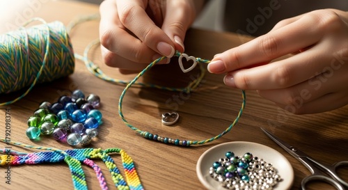 DIY Crafting Womans Hands Making Heart Bracelet.