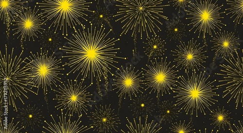 Vibrant yellow fireworks explode against a dark, starry night sky in a festive display.