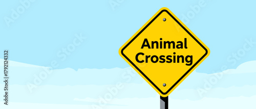 Animal Crossing warning sign in bright yellow on a clear blue sky  