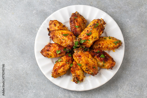 Grilled chicken wings in th...