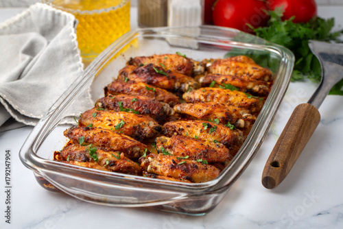 Grilled chicken wings in th...