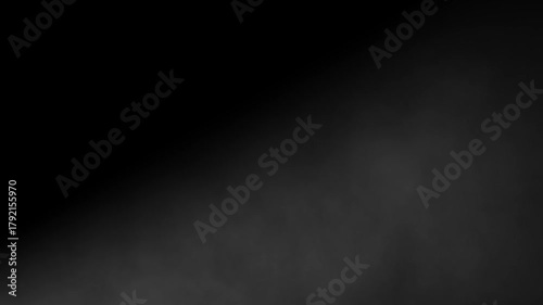 Slow motion abstract smoke or fog moving diagonally from left to right on a dark black background. Ethereal atmospheric vapor texture overlay element for visual effects, transitions, and moody scenes.