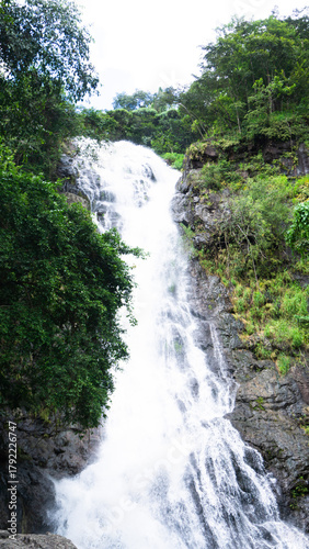 Majestic Tropical Waterfall Flowing Through Lush Green Forest, Nature Landscape in Southeast Asia