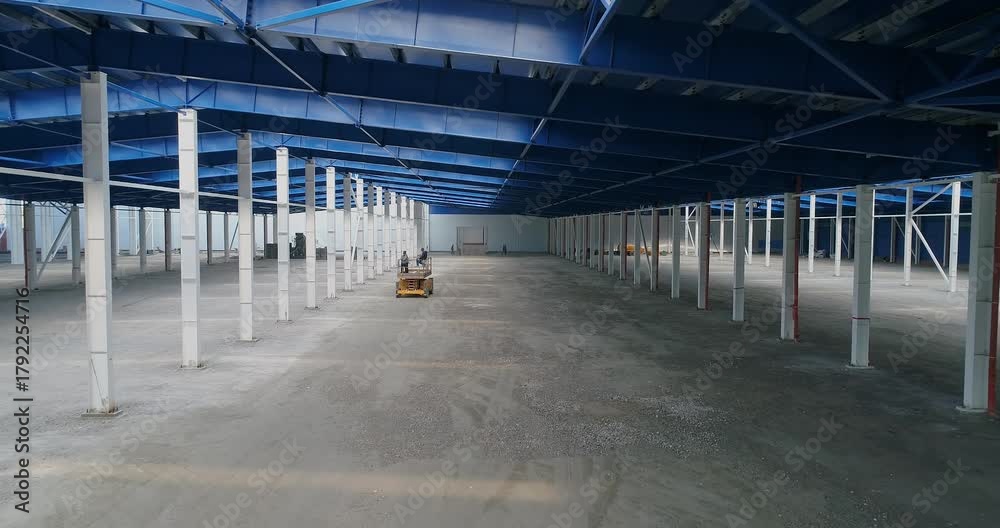 Industrial workshop is under construction. Steel structure in the industrial factory. Factory building Steel structure. The interior of a big industrial building or factory with steel constructions.