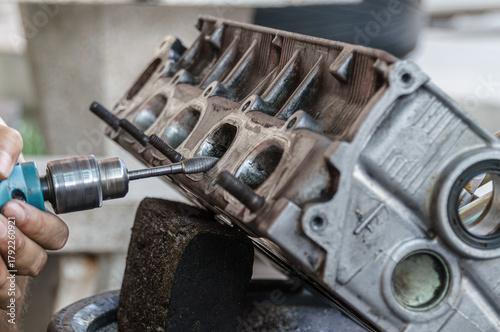 Valve Seat Grinding in Engine Repair Process for Precision Performance. Ideal for illustrating mechanical engineering and automotive repair techniques.