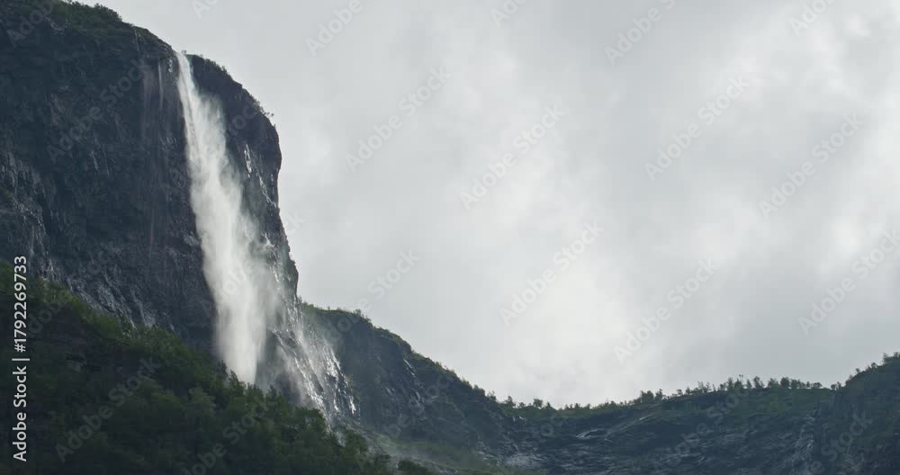 Flam Norway 4K Waterfall Falls from Fjord Cliff under Overcast Sky Aurlandsfjord