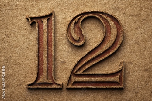 Vintage Styled Number Twelve with Ornate Details on Brown Background