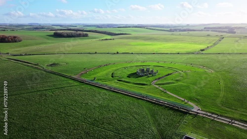 High wide aerial shot of Stonehenge with large numbers of tourists.