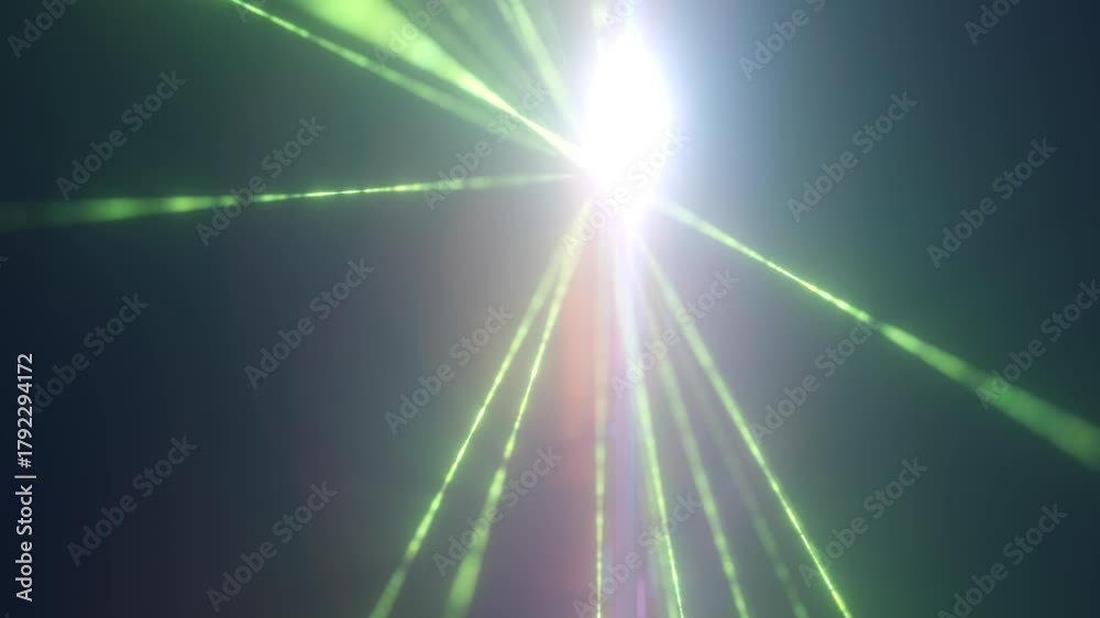 Bright green laser beams converging in a soft mist