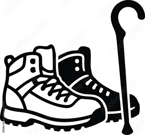 Hiking boots silhouette with walking stick