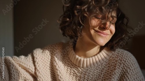 Smiling woman in a chunky knitted sweater, cozy indoor light, Scandinavian neutral palette, soft beige, cream and terracotta hues