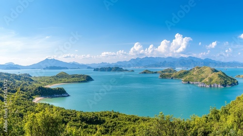 Wallpaper Mural 120.Majestic panoramic view of Lan Ha Bay from Cat Ba Island, with towering limestone karsts rising from the emerald-green waters, surrounded by lush vegetation and distant islands under a bright Torontodigital.ca