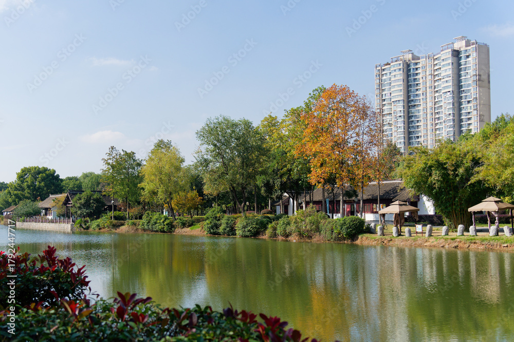 Fototapeta premium Treasure Boat Shipyard Site Park - The park preserves three dry dock pools and features attractions like a museum, a full-size replica of a treasure ship