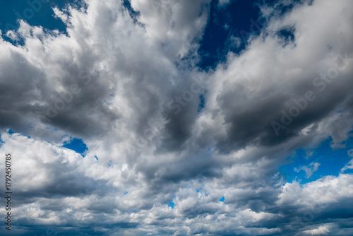 The dark sky with heavy clouds converging and a violent storm before the rain.Bad or moody weather sky and environment. carbon dioxide emissions, greenhouse effect, global warming, climate change.