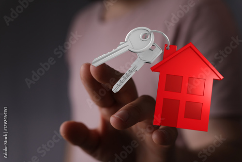 A hand offers the keys to a...
