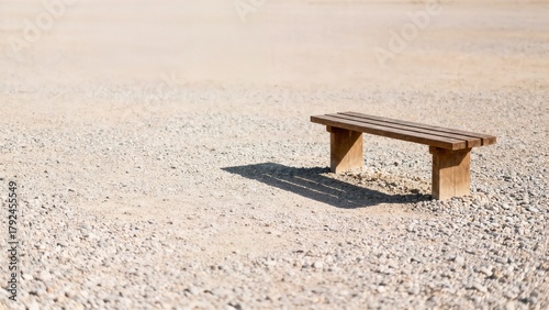 Wallpaper Mural Wide Minimal View of Wooden Bench Casting Long Shadow on Neutral Gravel Ground Torontodigital.ca
