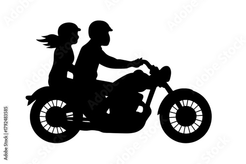 Silhouette of a couple riding a classic cruiser motorcycle wearing helmets on a road trip adventure