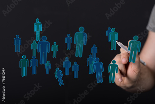 Concept of global connection. Digital human figures. Social network concept.  Hand selecting figures in a virtu