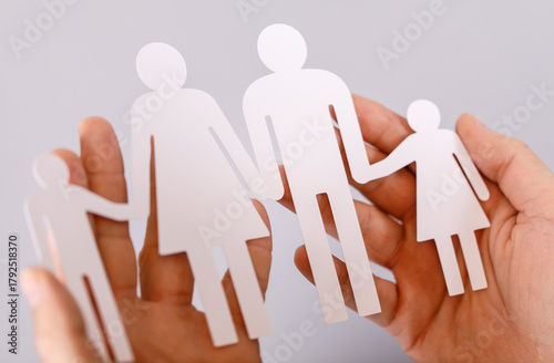 A person's hands holding pa...