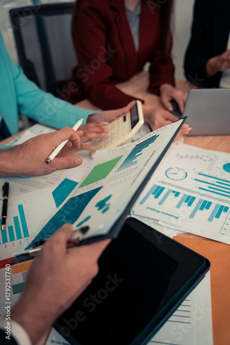 Businessman and team analyzing statistics with documents and graphs. Accounting consultant dealing with data, budget and profit chart for company. Close up.