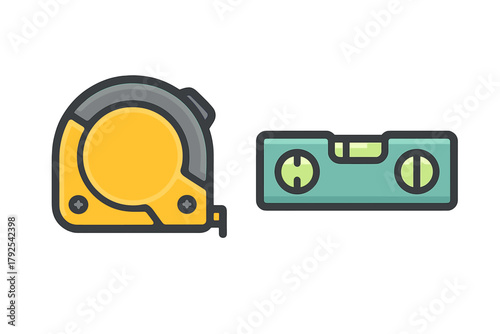 Yellow measuring tape and green bubble level essential tools for construction and home renovation