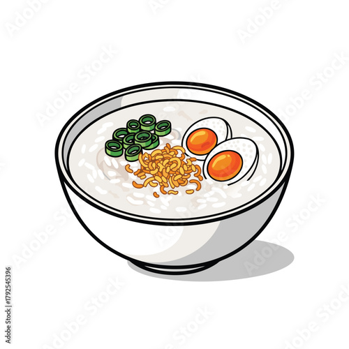 A bowl of congee with sliced green onions, crispy fried shallots, and two halves of a hard-boiled egg.