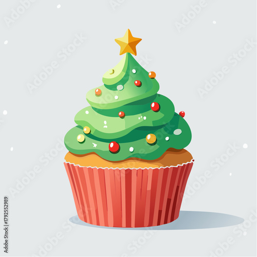 Festive Christmas tree cupcake with colorful frosting and star decoration.