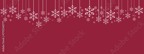 Festive holiday border/banner with white hanging snowflakes of varying sizes suspended by thin lines against a deep red background. Simple, elegant design suitable for Christmas, New Year