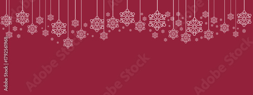Festive holiday border/banner with white hanging snowflakes of varying sizes suspended by thin lines against a deep red background. Simple, elegant design suitable for Christmas, New Year