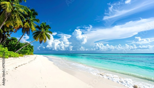 Fototapeta Naklejka Na Ścianę i Meble -  Pristine beach with turquoise water, white sand, and swaying palm trees under a clear blue sky with fluffy clouds
