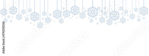 Winter holiday border or banner with pale blue hanging snowflakes of various sizes suspended by thin lines against a clean white background. Minimalist, cold-toned design suitable for winter.