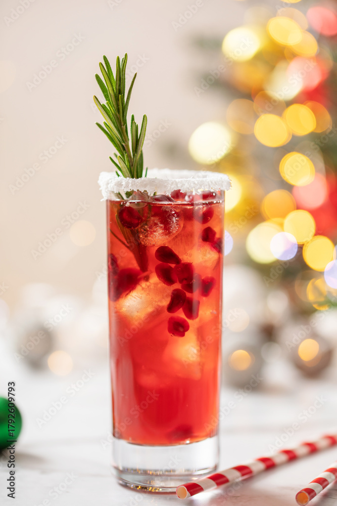 Fototapeta premium Festive alcoholic cocktail Mr Claus with pomegranate and vodka in highball on the table