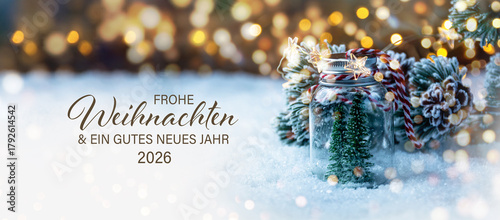 Christmas greeting card with text in German - Frohe Weihnachten means Merry Christmas and Happy New Year 2026 - Beautiful xmas decoration with Christmas tree in snow - Background banner, header