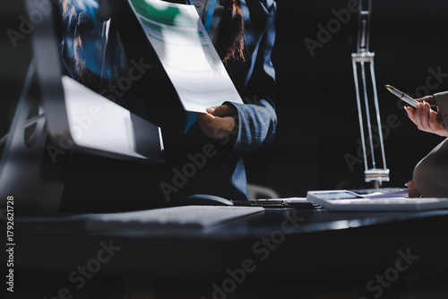 Close up high angle Asian businesswoman working with her coworker in meeting room