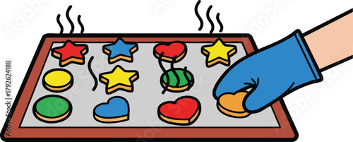 Hand Wearing Blue Glove Placing Cookie on Baking Sheet With Various Shaped Cookies