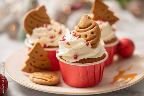Homemade cupcakes with whipped cream and gingerbread cookies for Holidays