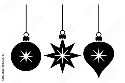 Festive Christmas ornaments hang elegantly, celebrating the holiday spirit with sparkling designs.
