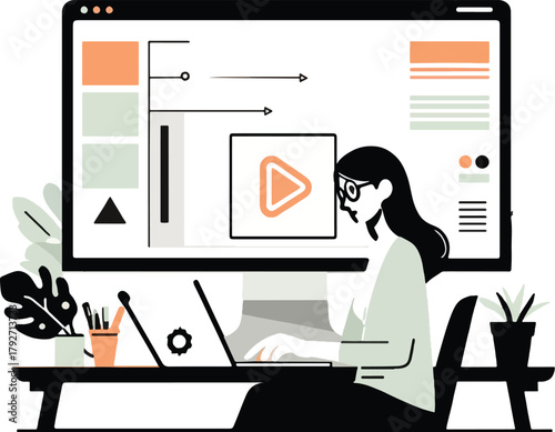 Woman working on laptop with large monitor displaying video player