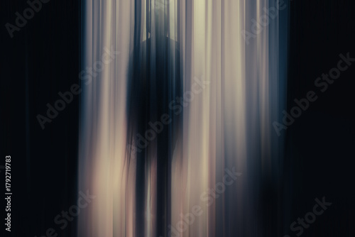 Dark Silhouette of a Person in Abstract Light Flow at Night