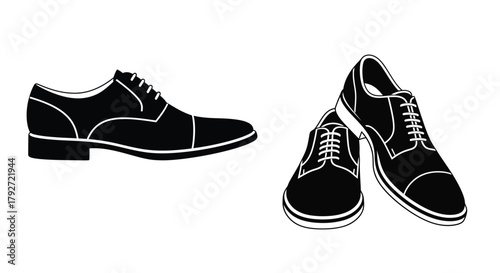A pair of classic black and white wingtip dress shoes side view