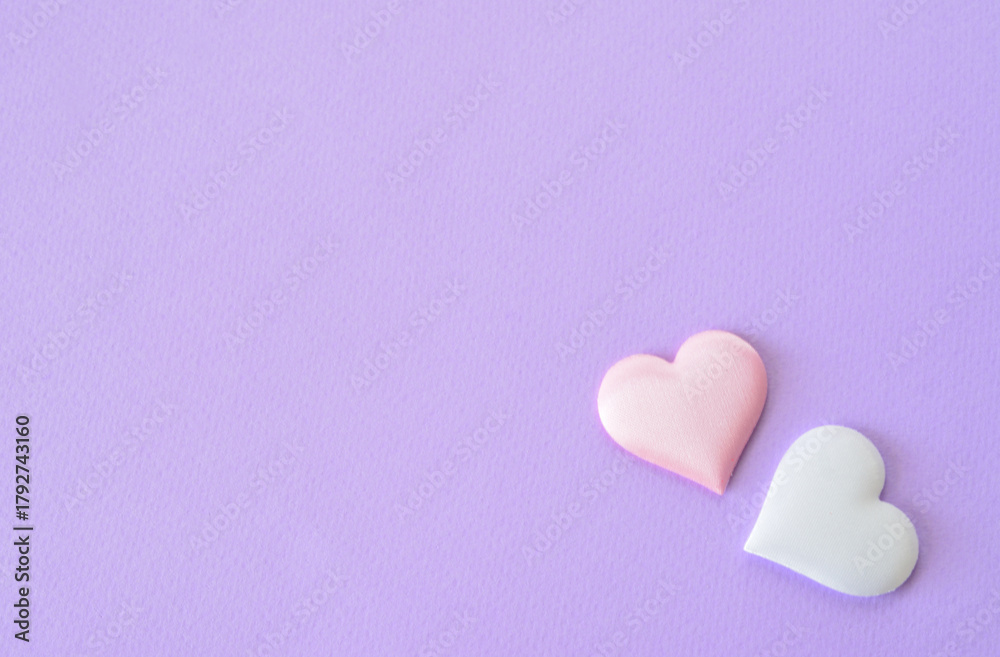 Fototapeta premium Two Soft Hearts on a Lavender Background blank space