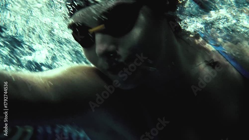 Underwater of Professional Female Swimmer Swimming Freestyle Toward Camera