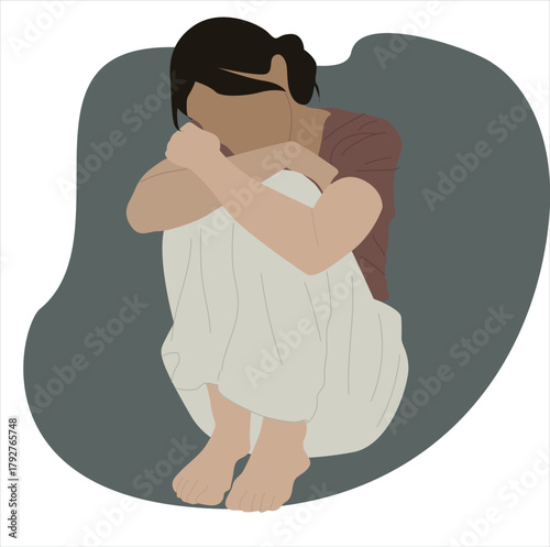 sad woman hugging her knees