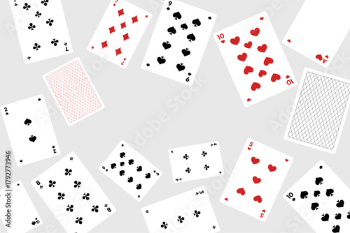 Playing cards scattered on gray background poker deck pattern