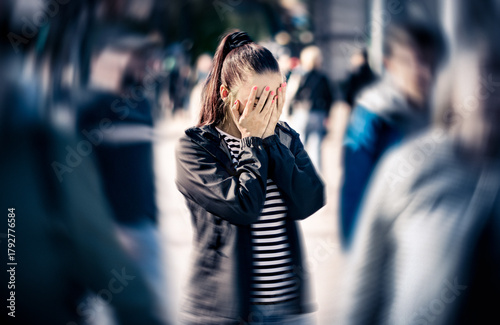 Anxiety, panic attack or fear in street. Stress or schizophrenia. Depressed woman with mental health disorder or agoraphobia. Afraid of crowd of people.