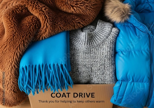 Warm winter clothing packed in a donation box ready for a coat drive, helping those in need stay cozy and protected from the cold