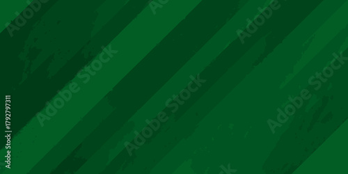 Abstract diagonal brush stroke pattern in varying shades of deep green with textured grunge effect