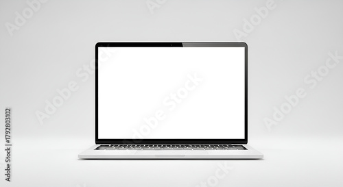 A minimalist laptop with a blank white screen displayed on a plain white background in a studio setting