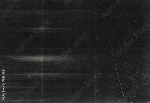 Dark grunge texture background with subtle scratches, dust specks, and linear marks to elevate digital artwork, photography backdrops, posters, branding projects