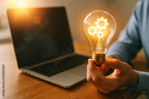 Bright lightbulb with mechanical gears concept of invention creativity research productivity and business inspired innovation